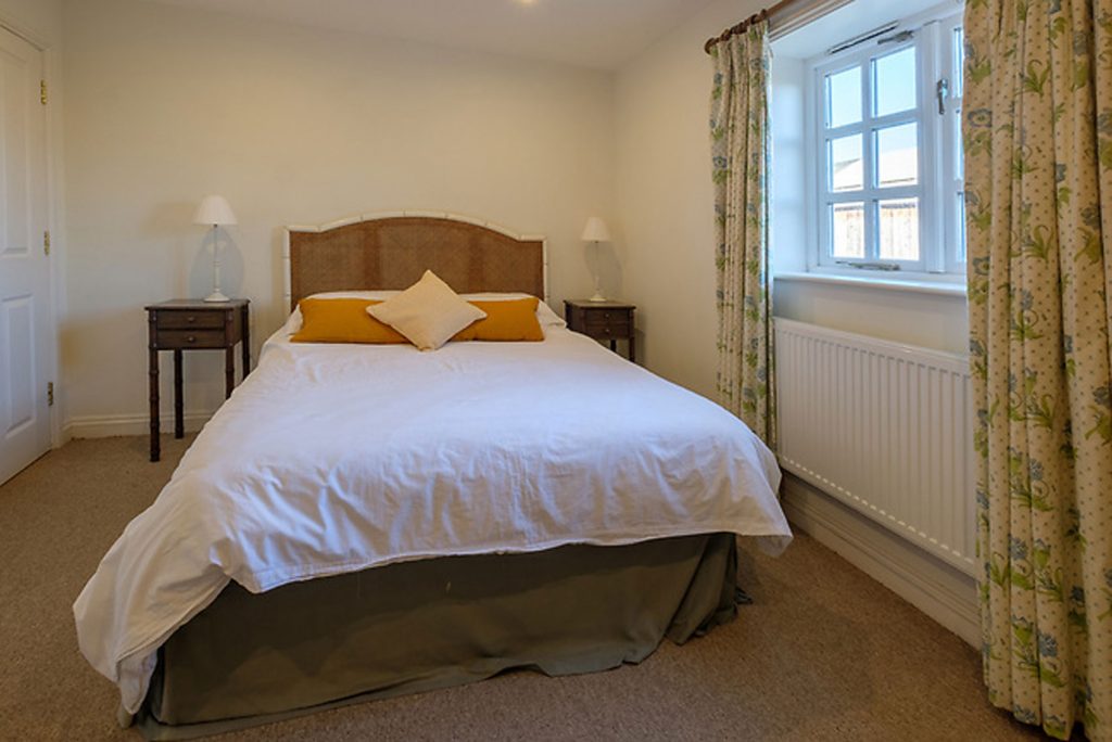 Shalfleet Barn Master bedroom complete with bed side tables and wardrobe